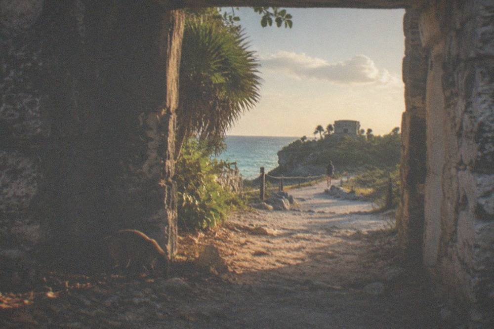A quiet stone gateway in the ancient wall with the sea visible beyond