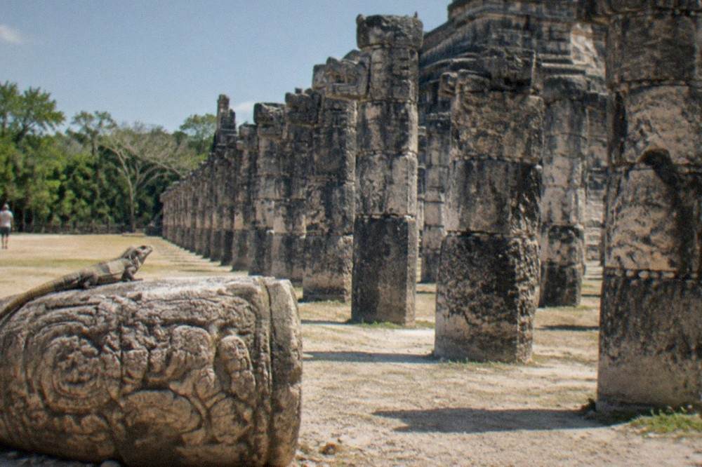 Stone columns of the Temple of the Warriors standing in rows on a flat plaza