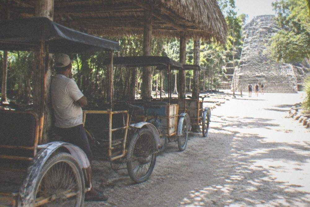Bicycles parked beside a jungle sacbe path at Coba
