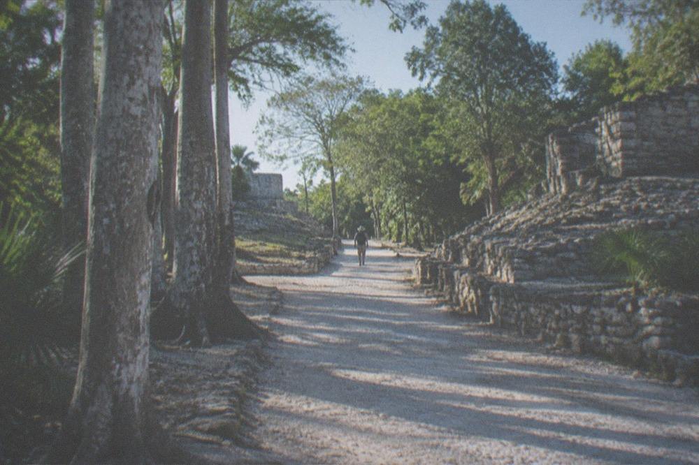 Open jungle path at Coba with few visitors in morning light
