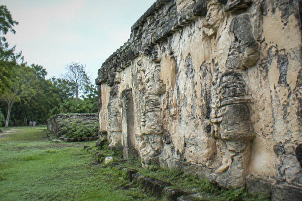 Carved stucco figures on the Acropolis entrance facade at Ek Balam