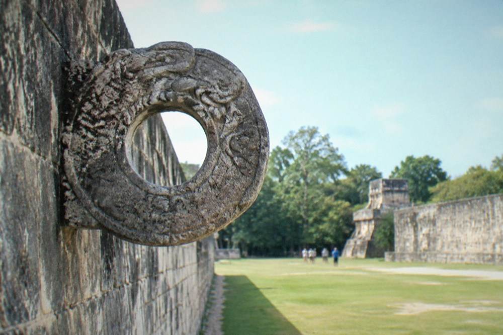 The great stone ring wall of the ball court at Chichen Itza in morning light