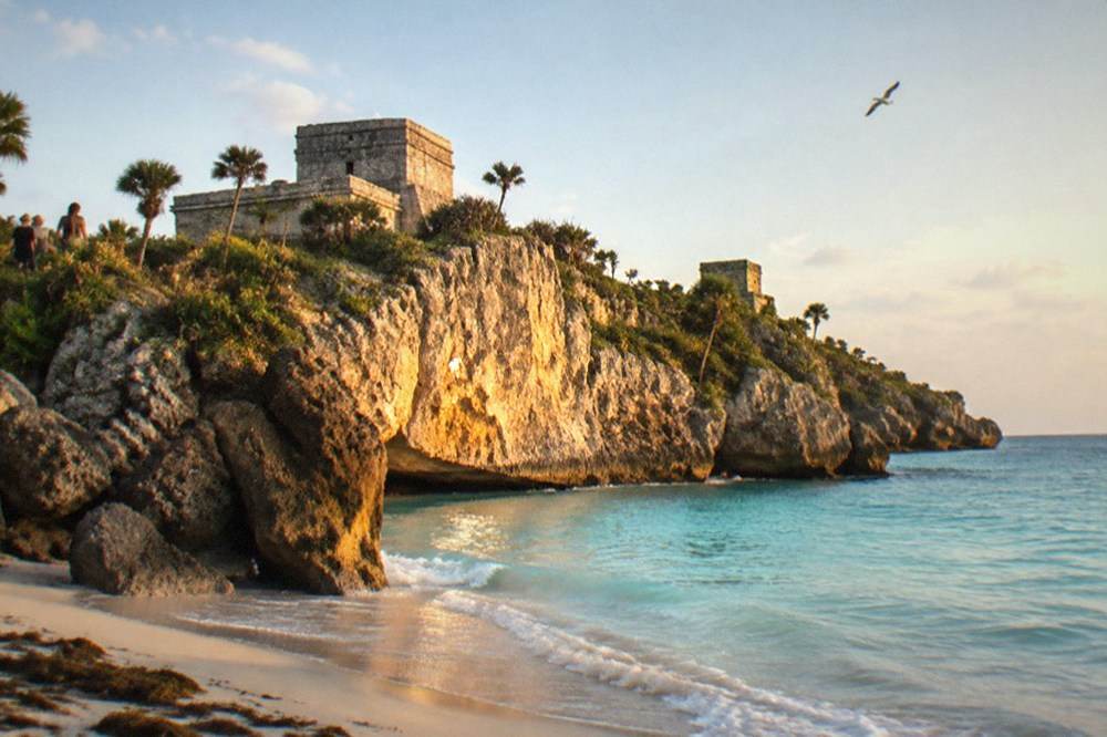 Morning light on the sea cliff below El Castillo with almost no visitors present