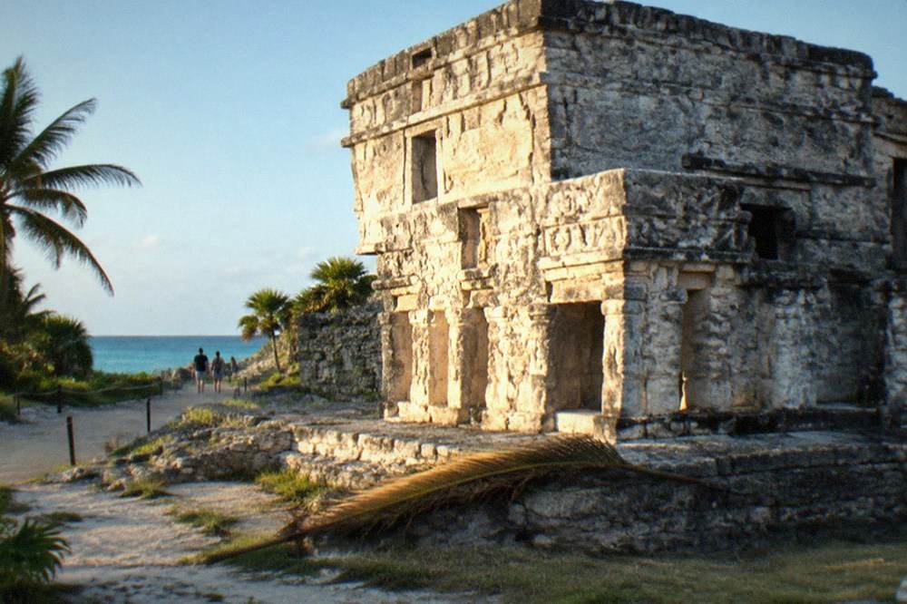Sunlight falling on the Temple of the Frescoes at the Tulum archaeological site in early morning