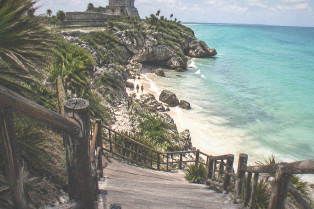 A small protected beach cove below the cliffs near El Castillo at the Tulum ruins